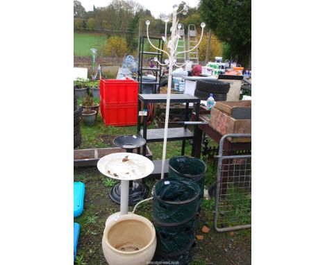 Two metal bird baths, glazed planter, a coat stand and a three tier plastic shelf.