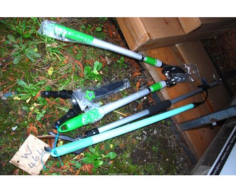 A cultivator, long armed pruner, an adjustable lopper and garden shears.