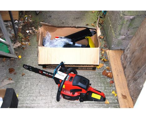 A "Bu-Ko" petrol chainsaw (in good working order at time of lotting) with spare cutter bar, gloves, etc.