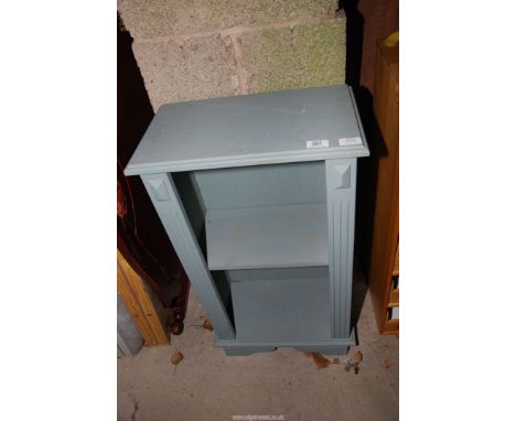 A grey painted shelf unit.