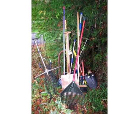 A quantity of tools, new shovels but no handles, brushes, fork, garden shears, etc.