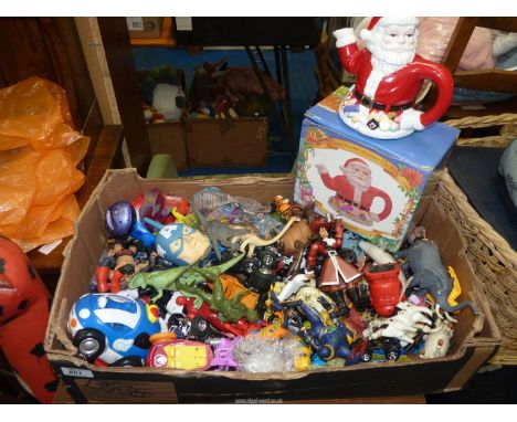 A box of toys and a Father Christmas Teapot.