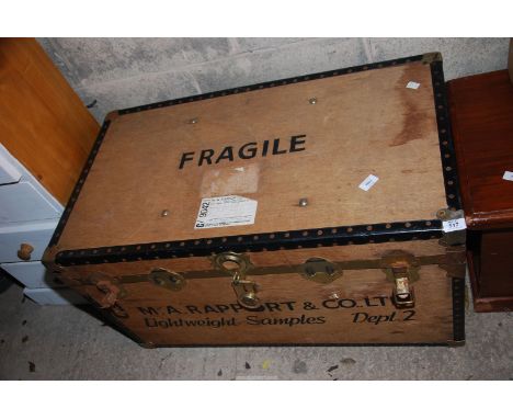 A wooden metal bound trunk and a large lamp with shade, 3' wide x 20" depth x 20" high.