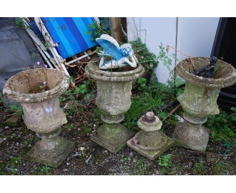 Three concrete urns on square bases, 14" diameter x 20" high plus two garden fairy ornaments.