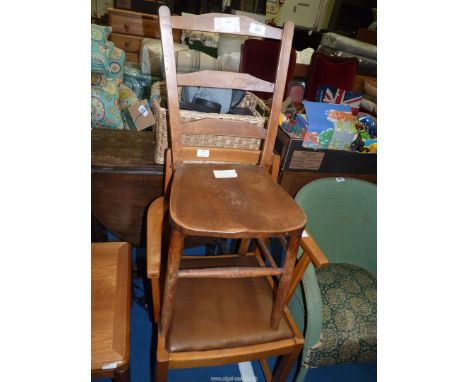 A ladder back kitchen chair and a lightwood carver chair.