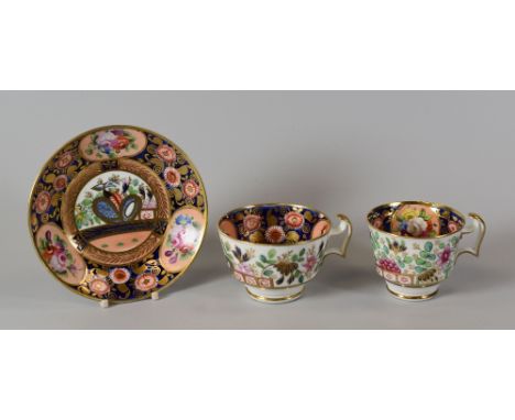 A SWANSEA 'JAPAN' PATTERN TRIO of cups and saucer, the interior of the cups and saucer profusely decorated with a cobalt-blue