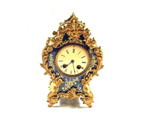 A French gilt metal mantel clock with blue enamel dial surround