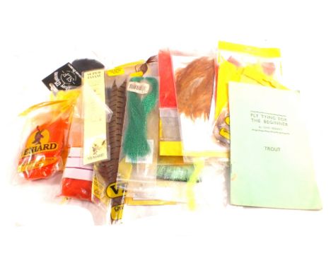 A box of fly tying tools and materials