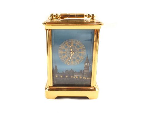 A Brass carriage clock in case with House of Parliament decorated dial and original receipt