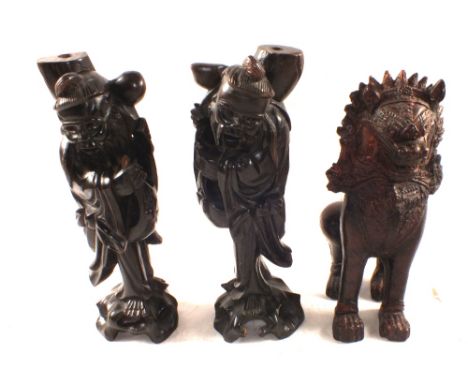 Two Chinese hardwood sage lamp bases and a pottery Dog of Fo