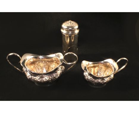 A Silver cream jug, sucrier and a large pepper