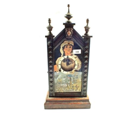 A Pine cased moving eye mantel clock with bird decorated glass