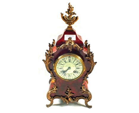 A French Tortoiseshell and gilt metal waisted mantel clock, Japy Freres movement