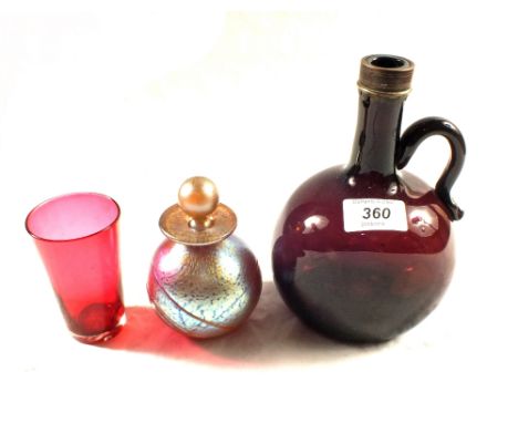 A 19th Century amethyst glass decanter, art glass scent bottle and a cranberry beaker