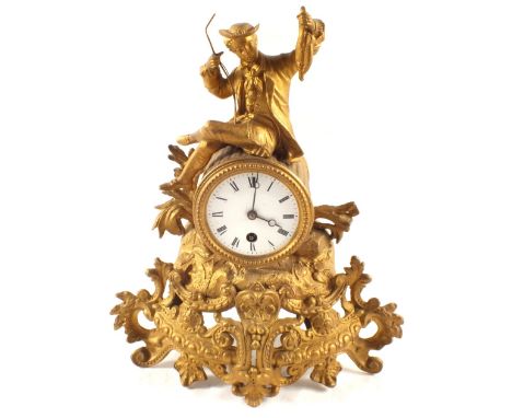 A bronzed jockey and horse plus a gilt metal mantel clock