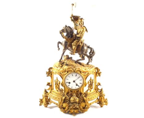 A 19th Century French gilt metal clock garniture with mounted Knight and trophies, movement by Henry Marc, Paris with a pair 