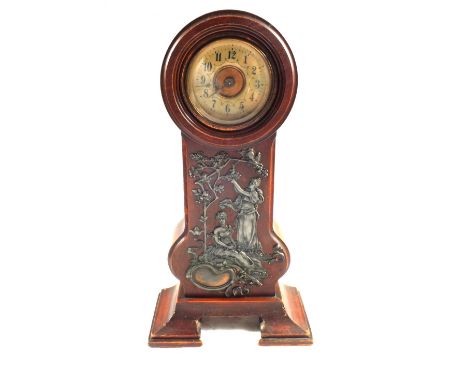 An Art Nouveau Mahogany mantel clock with applied Pewter lady and floral decoration