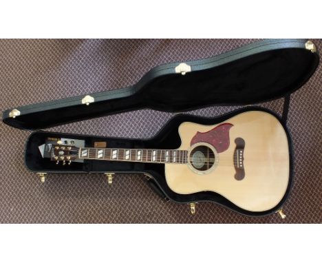 A cased Gibson Songwriter Delux Studio Cutaway Guitar with a fishman prefix Plus-T, it comes with an instruction manual and a