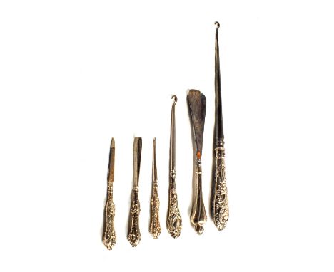 Six various Silver handled button hooks etc