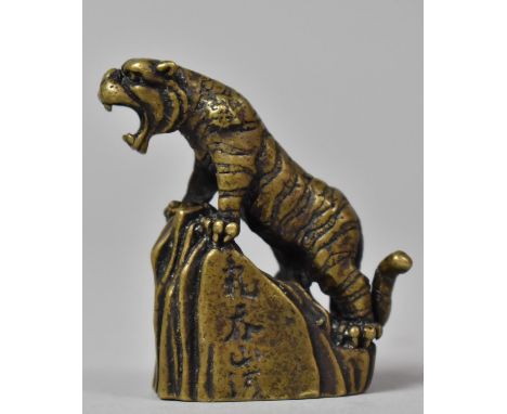A Chinese Bronze Study of a Roaring Tiger Upon Rock, Having Three Character Mark to Front, 5cm high 