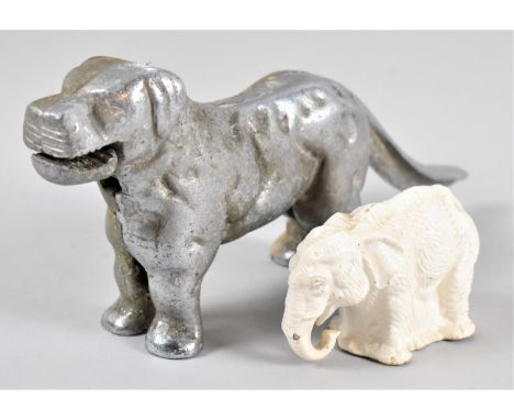 A Vintage Chromed Metal Novelty Nutcracker in the Form of a Dog, 29cm Long Together with a Elephant Money Box 