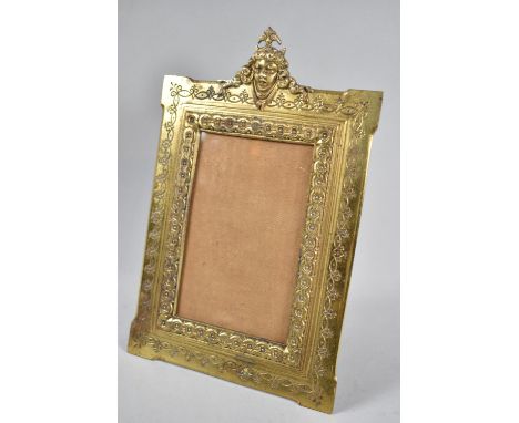 A French Bronze Easel Back Photo Frame with Horned Devil Finial, Stamped Back, 26cm High and 17cm wide 