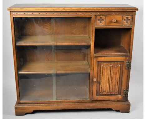 A Mid 20th Century Oak Linen Fold Bookcase, Glazed Shelf Main Section to the Side of Which is Small Drawer, Open Display and 