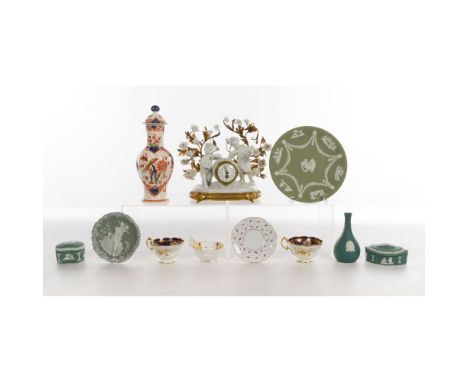 Porcelain Assortment  (11) items including a white porcelain and brass clock having two putti surrounded by vines and flowers