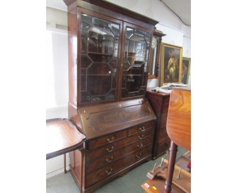 GEORGIAN DESIGN BUREAU BOOKCASE, a figured mahogany bureau base 2 short & 3 long graduated drawers with brass swan neck handl