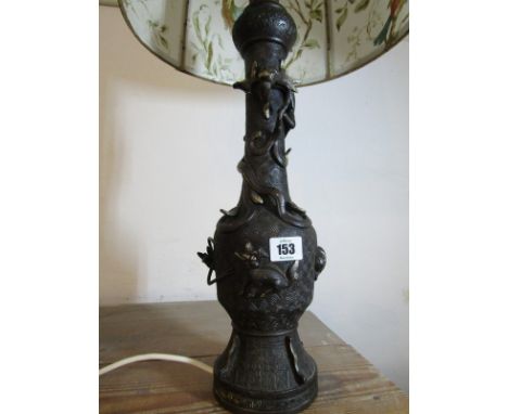 ORIENTAL METALWARE, a bronzed dragon decorated relief table lamp 16" base height