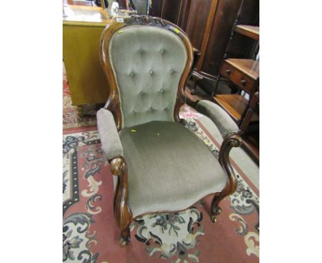 VICTORIAN BUTTON BACK ARMCHAIR,  a carved crested walnut button back armchair with cabriole arm supports