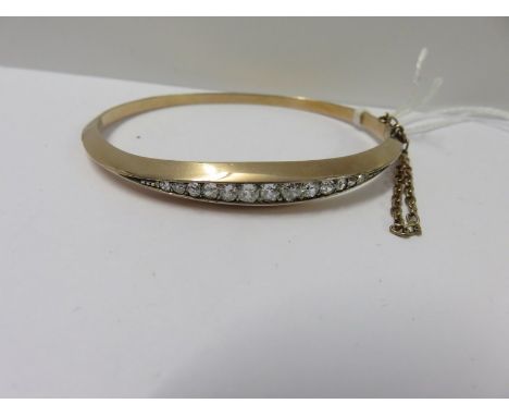 VINTAGE GOLD BANGLE set with approx. 1ct of old cut diamonds, bright well matched stones of good colour and clarity 