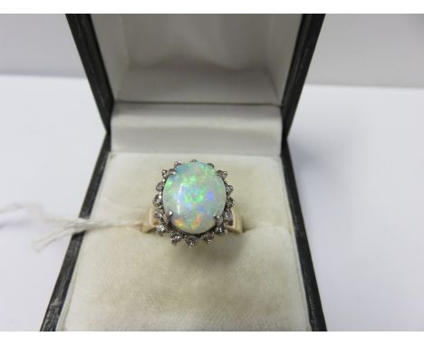 18ct GOLD OPAL & DIAMOND CLUSTER RING, large central opal (probably coober pedy) surrounded by small accent diamonds on 18ct 