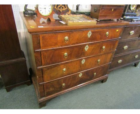 EARLY 18TH CENTURY WALNUT CHEST OF DRAWERS, 4 long graduated drawers with ring drop brass handles and escutcheons, 34.5" heig