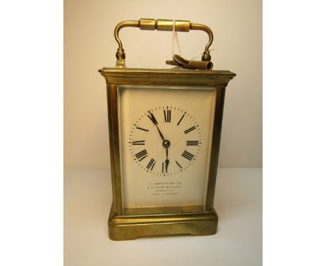 CARRIAGE CLOCK, bevelled glass brass cased carriage clock with coiled bar strike by S Smith & Son and key.