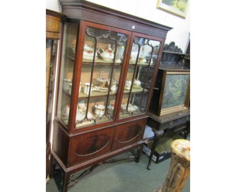 CHIPPENDALE REVIVAL DISPLAY CABINET, mahogany twin door cupboard base display cabinet with blind fretwork cornice and shaped 