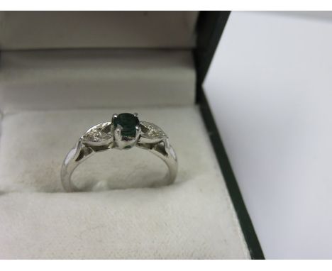 EMERALD & DIAMOND RING, white gold emerald and diamond ring, central emerald with small accent diamonds to either shoulder, s