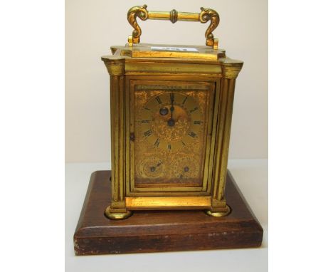 FINE CARRIAGE CLOCK, gilt brass case calendar aperture carriage clock with bell strike and finely engraved clock face, 5" hig