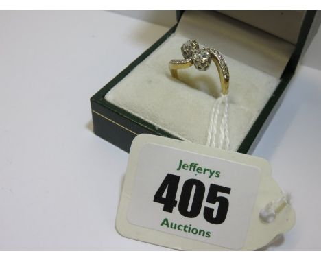 SUPERB 18CT GOLD DIAMOND CROSS OVER RING, well matched old cut diamonds the main stones each measuring over 4mm, total diamon