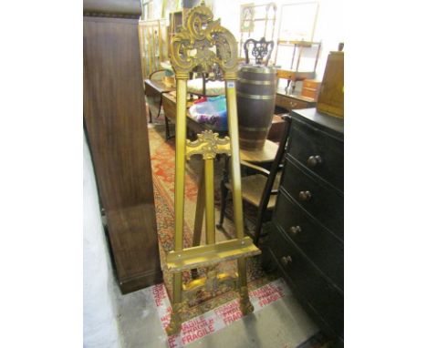 GILT PICTURE EASEL FRAME, an ornate gilded scroll crested easel frame
