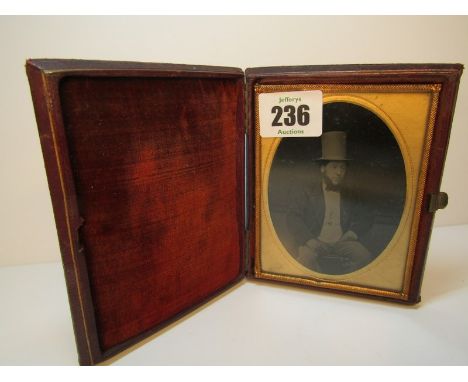 PHOTOGRAPHY, Victorian ambrotype portrait of seated gentleman in stove top hat