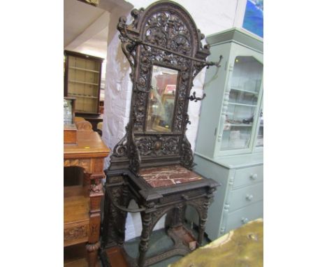 COALBROOKDALE, an impressive patinated cast iron mirrored back stand with inset marble shelf, 82" height, 36" width