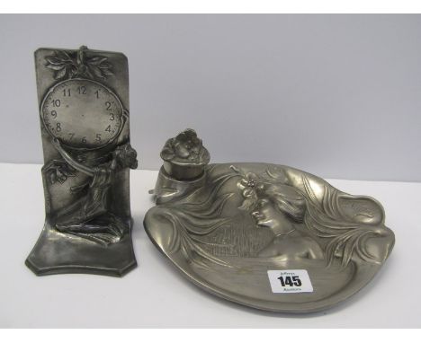 ART NOUVEAU PEWTER WATCH HOLDER in form of Young Lady with clock face together with similar ink well