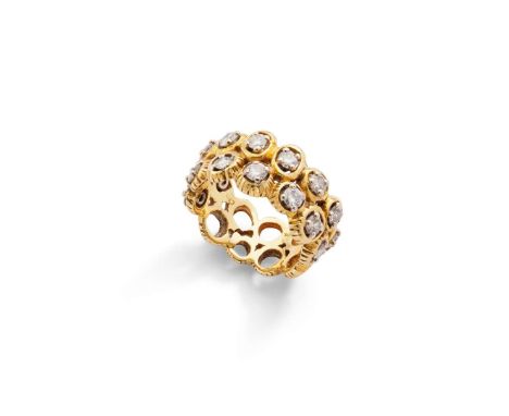  An abstract diamond ring, 1973  Designed as a continuous double row of openwork gold circular links, set with brilliant-cut 