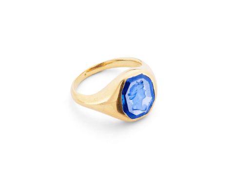  A sapphire intaglio ring, late 19th / early 20th century  The faceted sapphire, carved to depict Athena in profile looking r