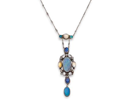  An Arts & Crafts pendant necklace, possibly by Sibyl Dunlop, circa 1910  The elongated pendant set with circular and oval ca