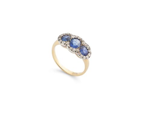  A sapphire and diamond triple cluster ring  Contoured to the band, centrally-set with an oval-cut sapphire, between circular