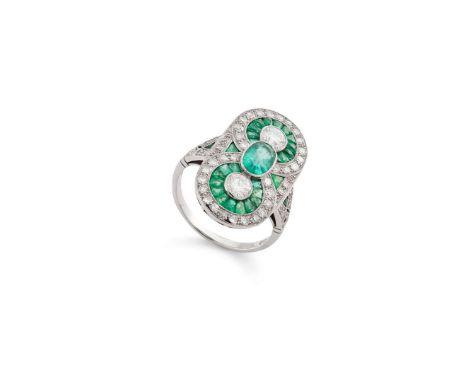  An Art Deco emerald and diamond plaque ring, circa 1930  Designed as a double target ring, each millegrain collet-set brilli
