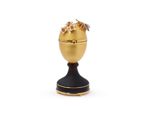  Victor Mayer for Fabergé: An enamel, citrine, smoky quartz and diamond 'Surprise' egg  The yellow guilloché enamelled egg de