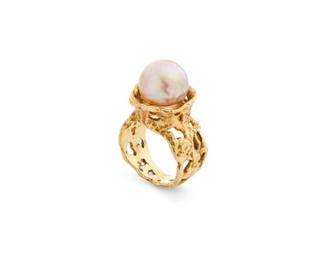  John Donald: A gold and cultured pearl 'Drum' ring, 1969  The 11.4mm cultured pearl, within a textured 18 carat gold surroun